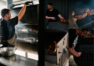 Chef tending to Beerfarm smoker, stoking fire and checking smoked meats 