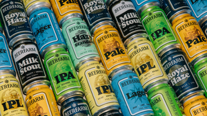 cans of Beerfarm beers stacked on top of each other in rows